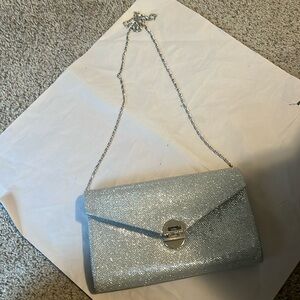 Silver clutch with shoulder chain! In very good condition!
